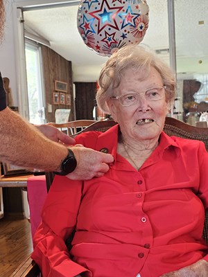 VWC&#39;s Rich Lovelady pins Gold Star mother, Virginia Kelly.  